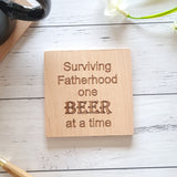 Surviving Fatherhood one beer at a time. Engraved wooden coaster with Father's Day quote